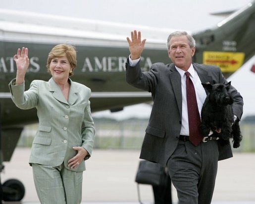 Laura Bush and George W. Bush walk with Barney from Marine One to Air Force One at TSTC Waco Airport on July 29, 2004. Official White House photo. 